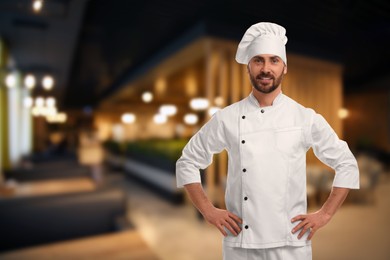 Image of Smiling chef in uniform at restaurant, space for text