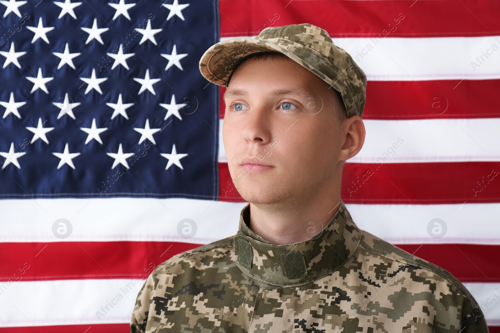 Photo of Soldier in uniform against United states of America flag