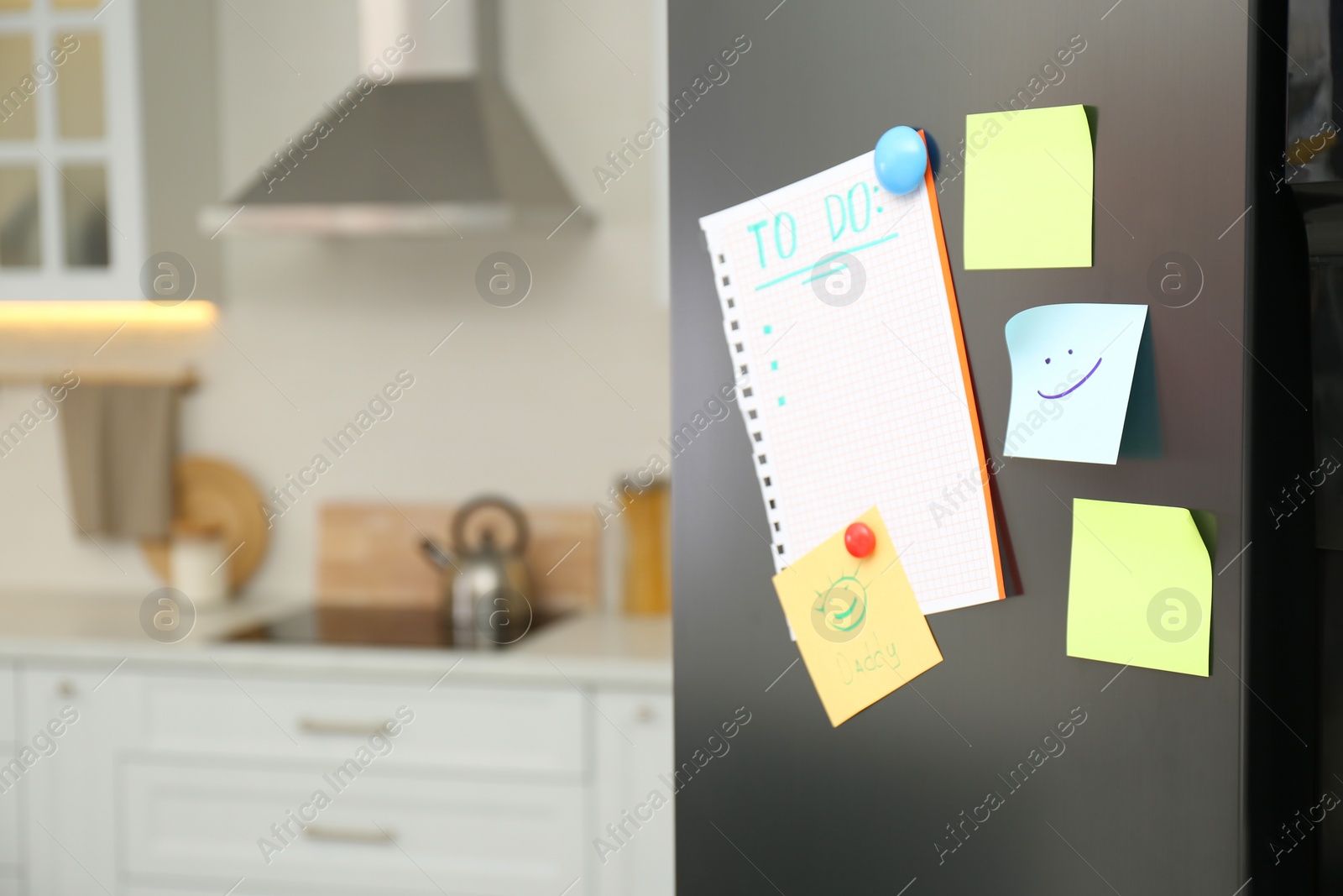 Photo of Blank to do list and sticky notes on fridge in kitchen. Space for text