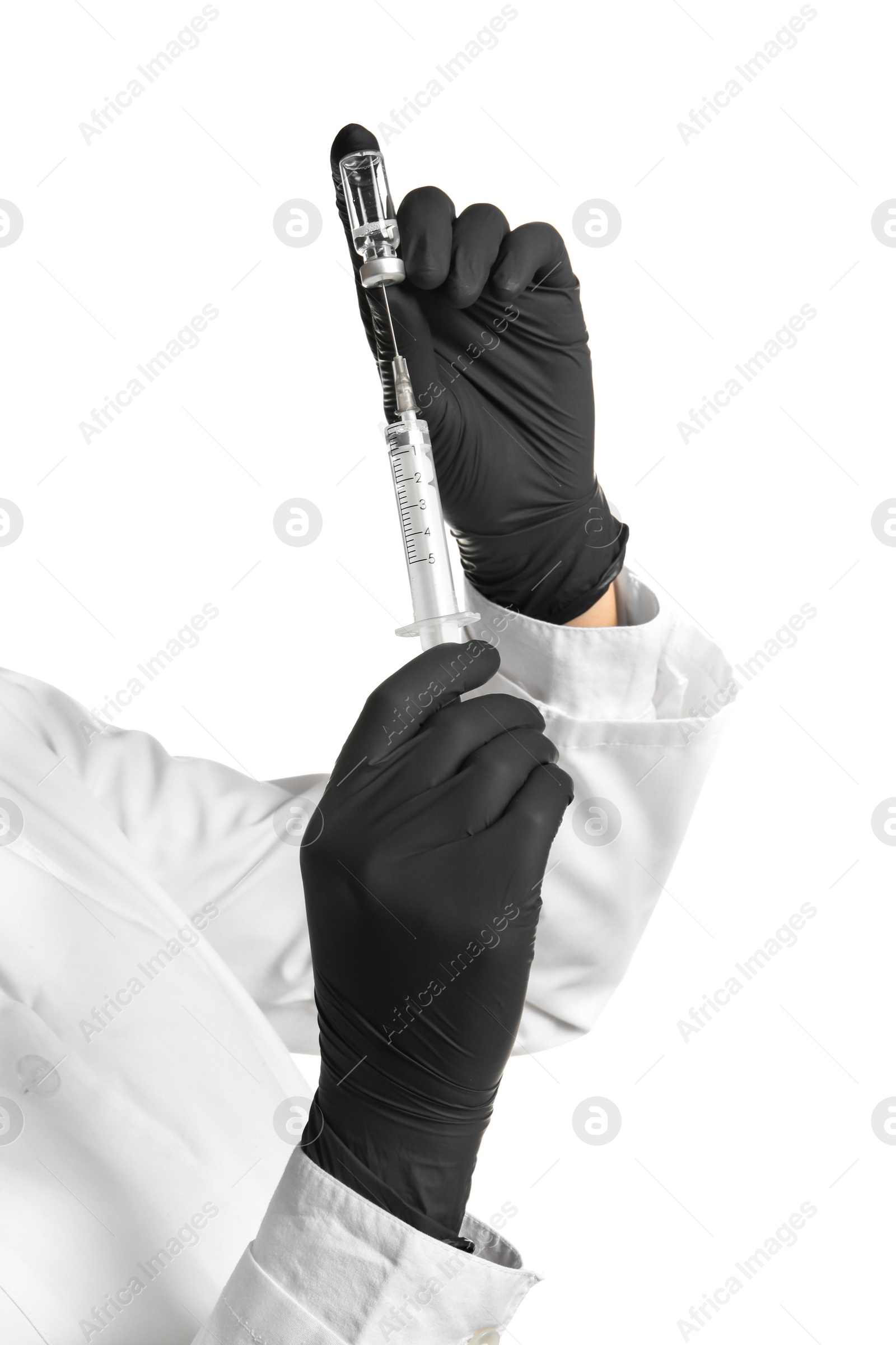 Photo of Doctor in medical gloves with syringe and vial on white background