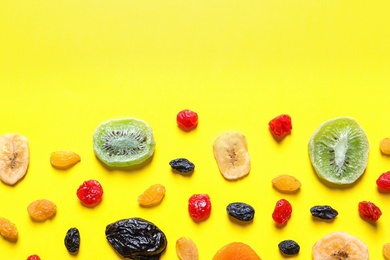 Different dried fruits on color background, top view with space for text. Healthy lifestyle