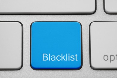 Blue button with word Blacklist on computer keyboard, closeup