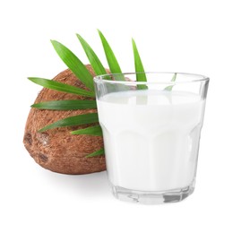 Glass of delicious vegan milk, coconut and leaf on white background