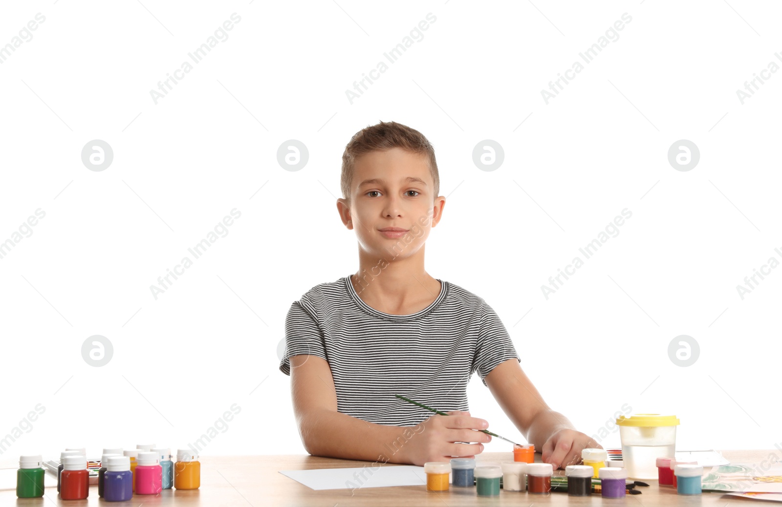 Photo of Cute child painting picture at table on white background