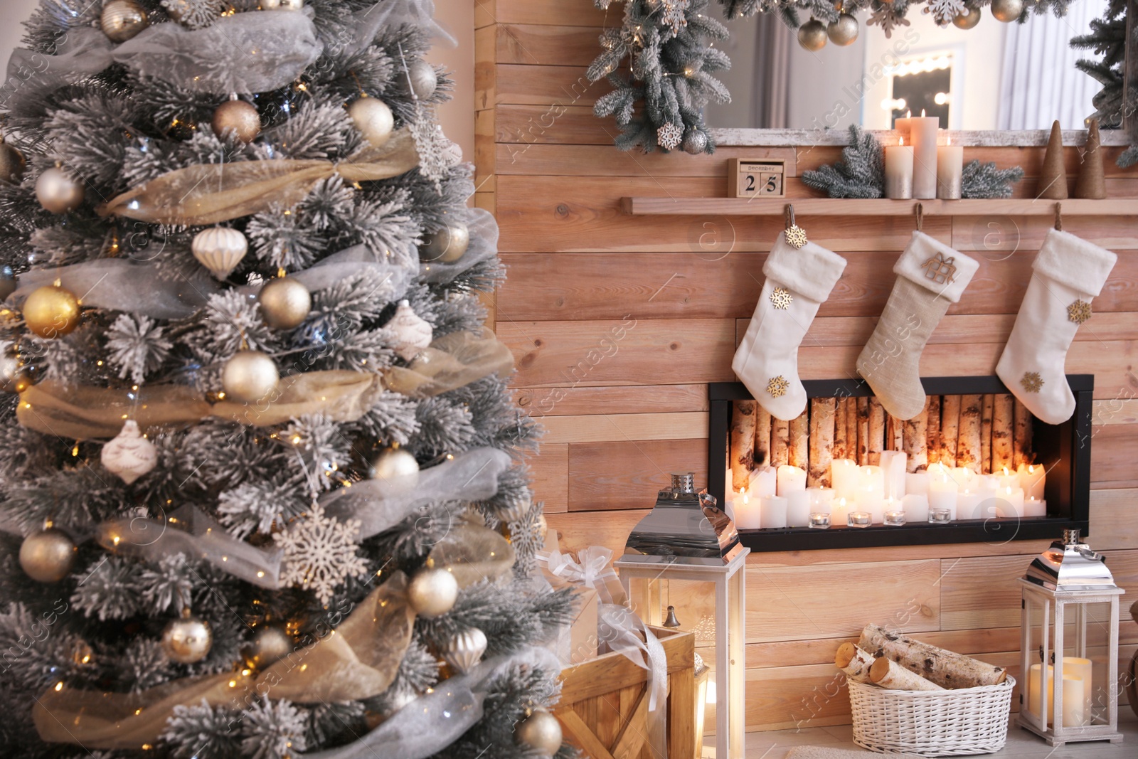 Photo of Christmas tree near decorative fireplace in room, closeup view. Festive interior