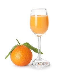 Photo of Tasty tangerine liqueur in glass and fresh fruit isolated on white