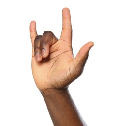 African-American man showing ROCK gesture on white background, closeup