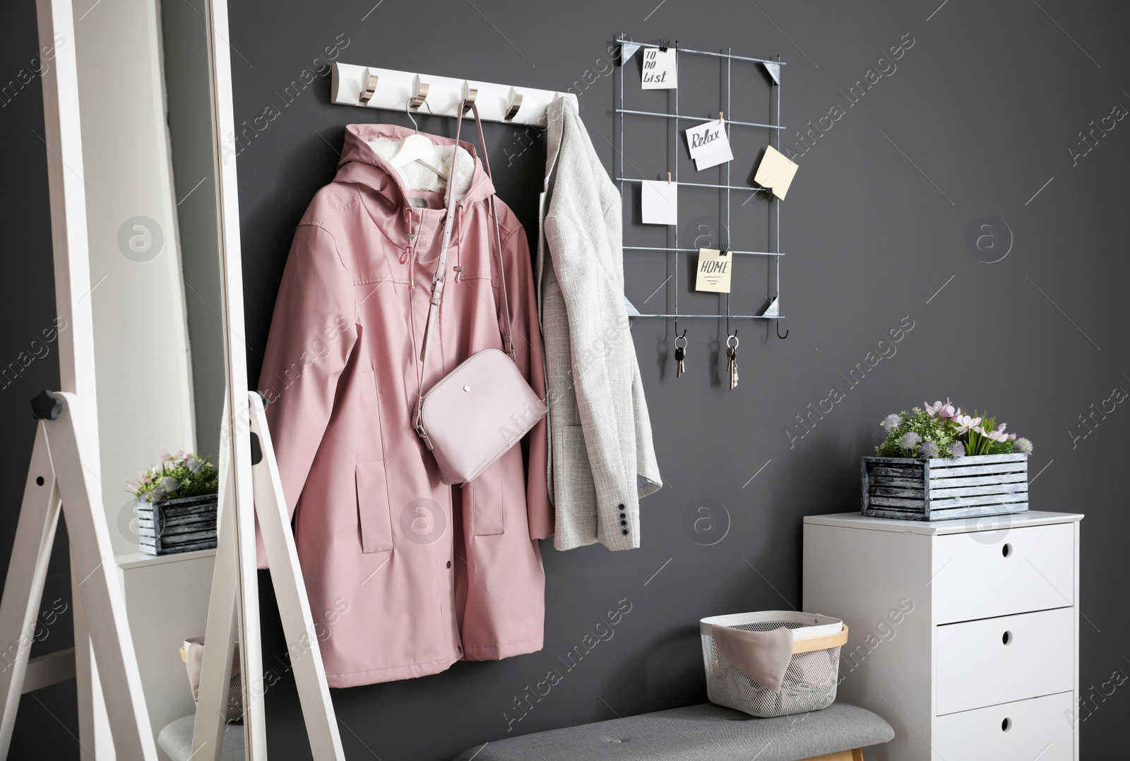 Photo of Hallway interior with stylish furniture, clothes and accessories
