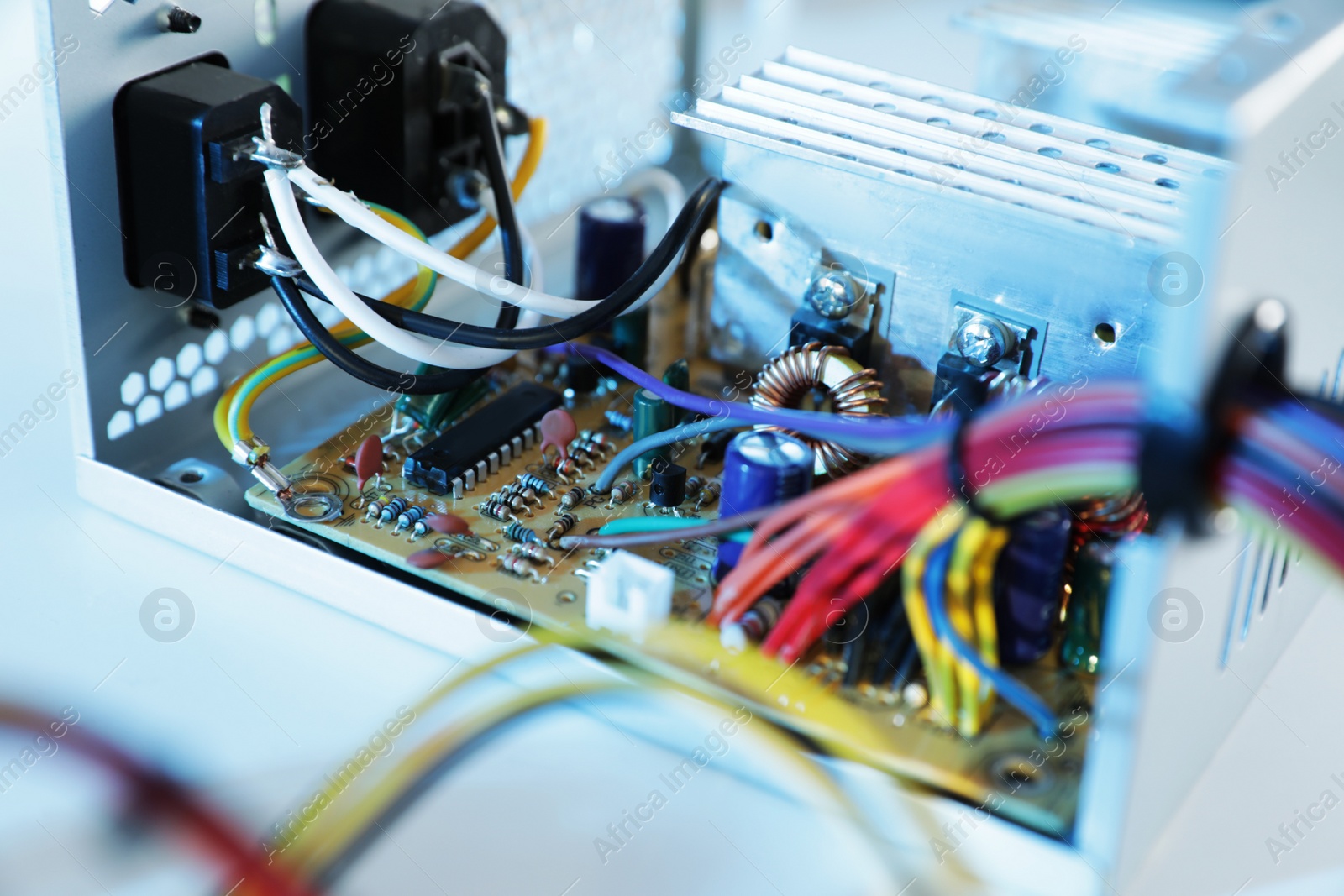 Photo of Power supply unit on table, closeup. Computer repair service