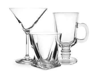 Image of Set of empty glasses on white background