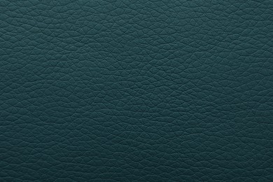 Texture of dark green leather as background, closeup