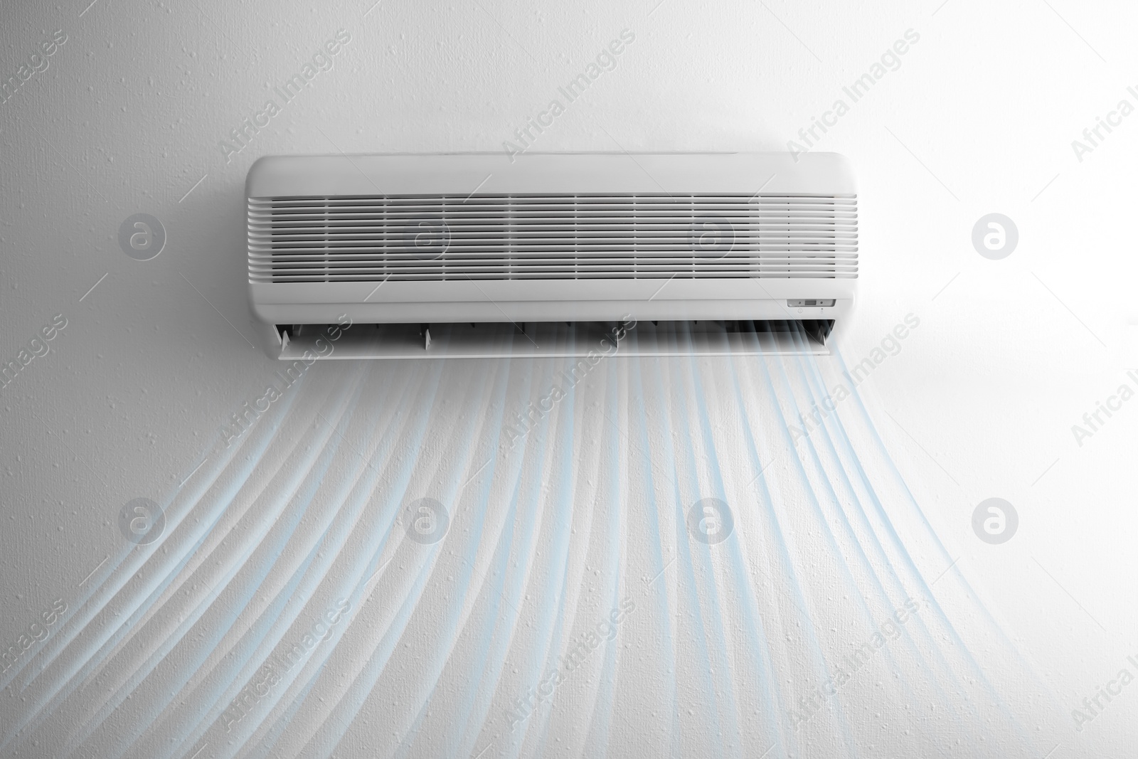 Image of Modern air conditioner on white wall indoors