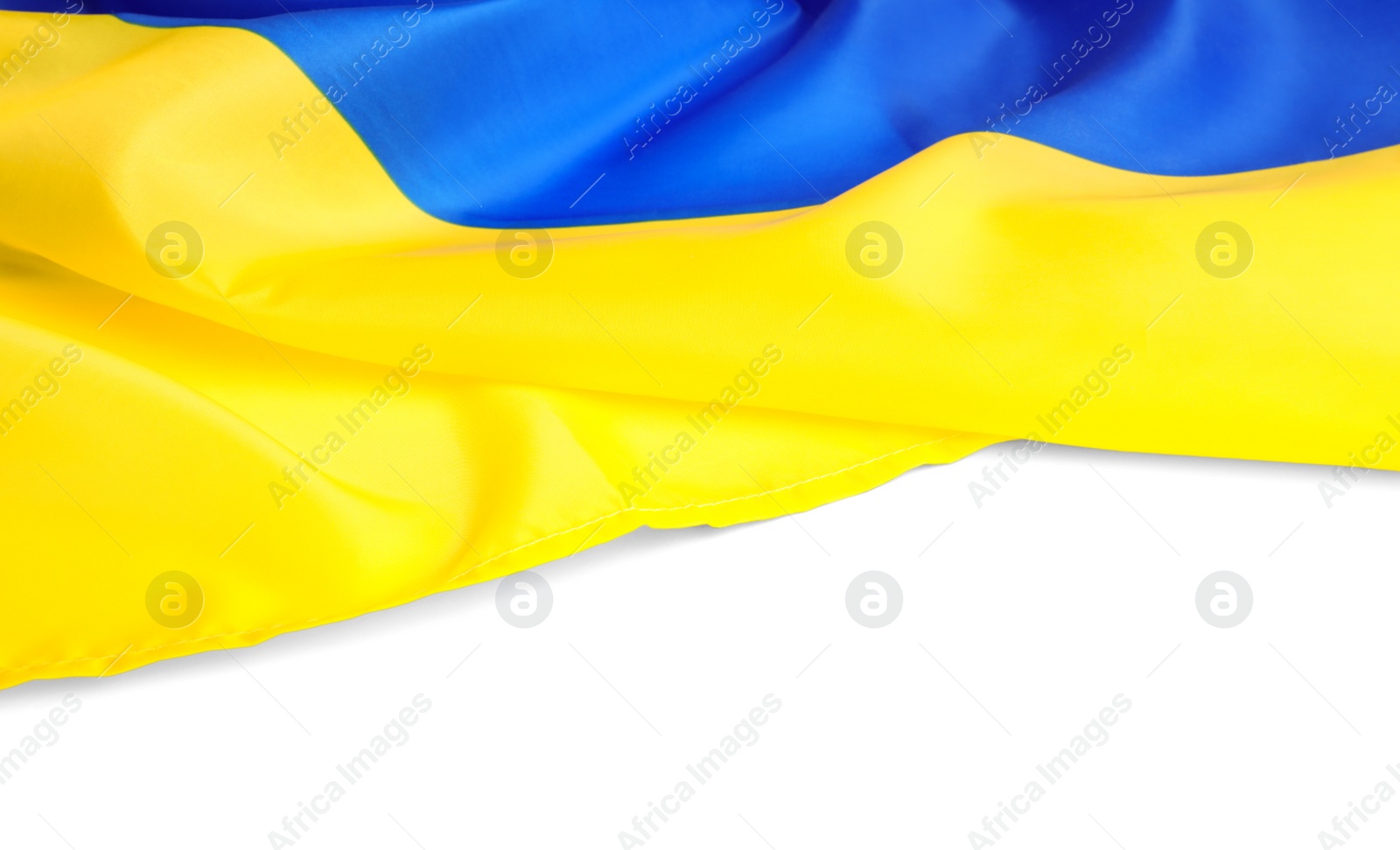 Photo of National flag of Ukraine on white background, closeup