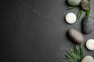 Photo of Flat lay composition with stones on black background, space for text. Zen concept