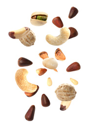 Image of Different nuts falling on white background 
