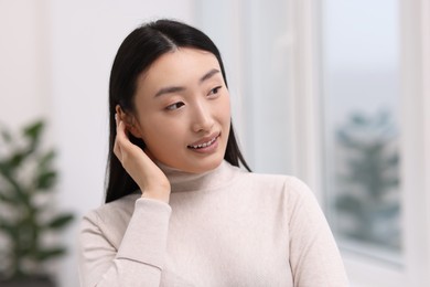 Photo of Portrait of smiling confident businesswoman in office