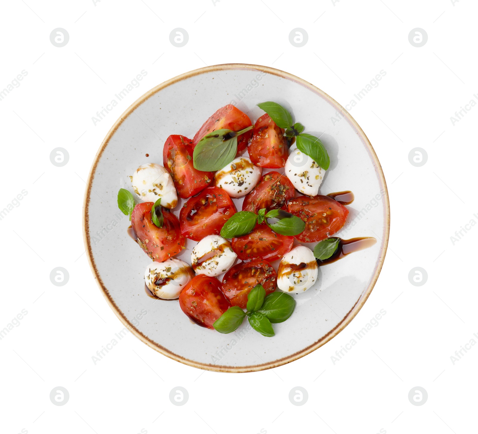 Photo of Tasty salad Caprese with mozarella balls, tomatoes, basil and sauce on white background, top view