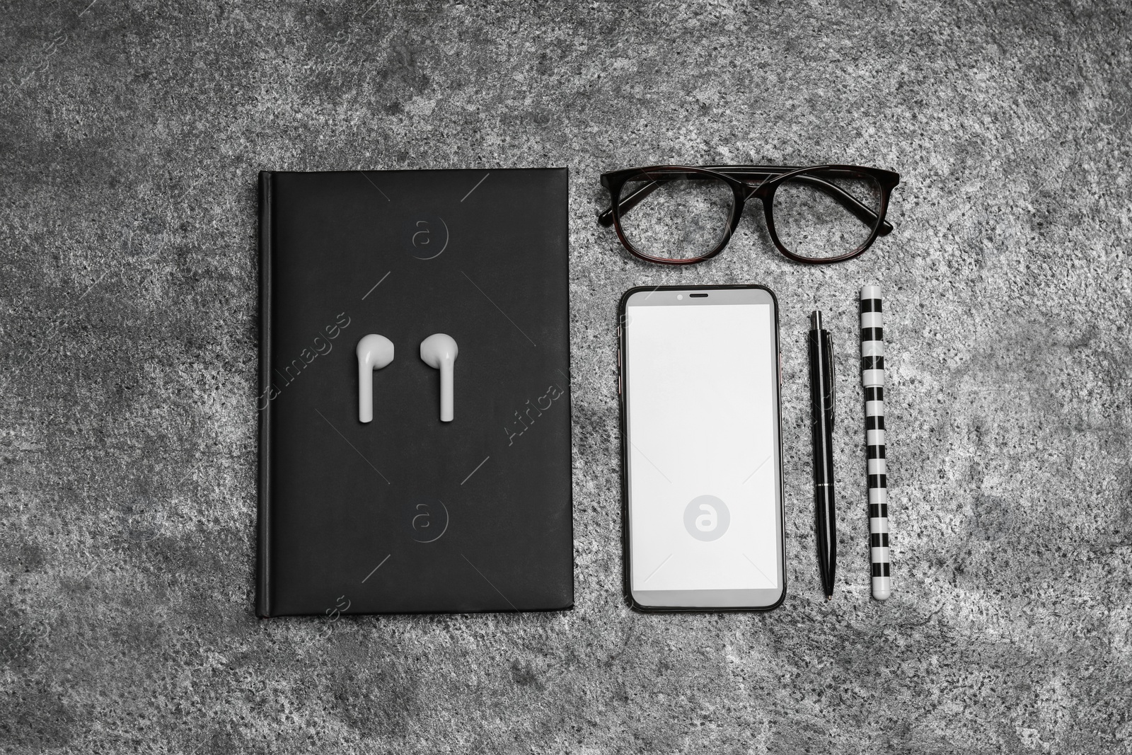 Photo of Flat lay composition with notebook and smartphone on grey background