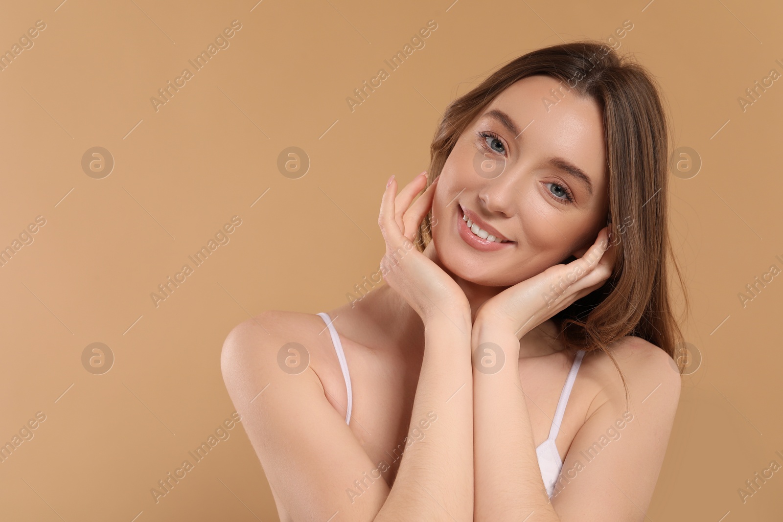 Photo of Beautiful woman with healthy skin on beige background, space for text