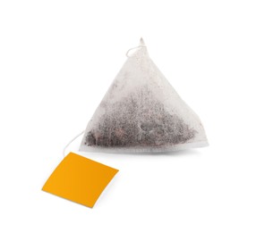 Photo of New pyramid tea bag isolated on white