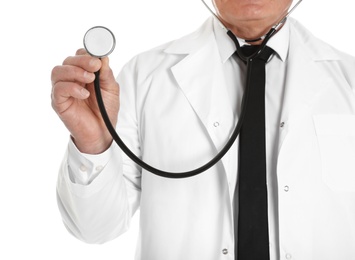 Photo of Male doctor with stethoscope isolated on white, closeup. Medical staff