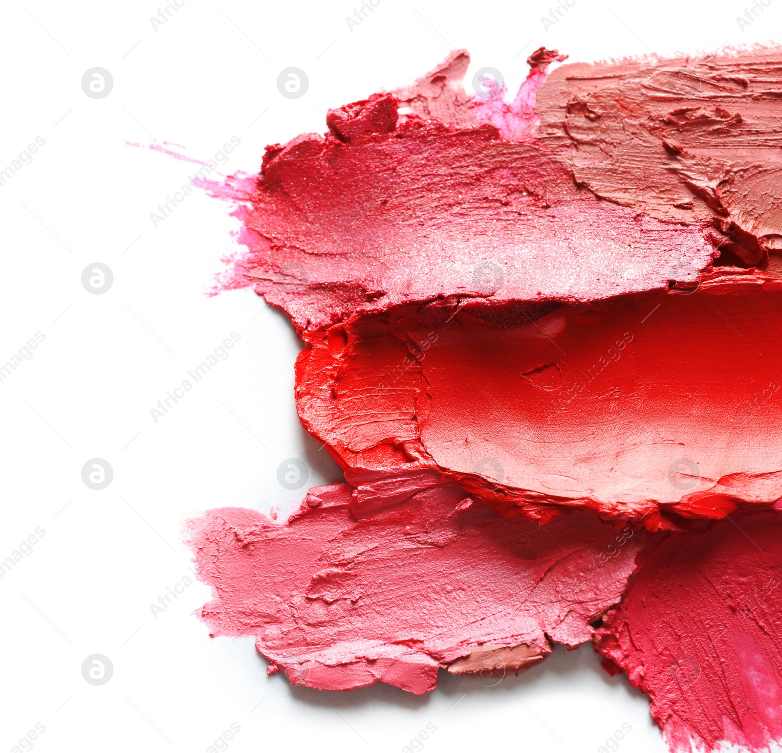 Photo of Collection of lipstick swatches on white background, top view