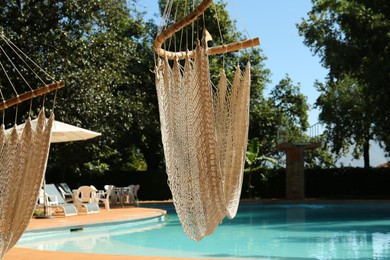 Hammock near pool with clean water outdoors