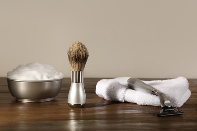 Set of men's shaving tools on wooden table