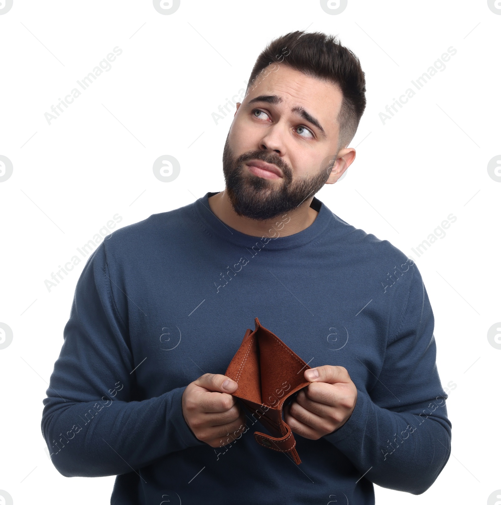 Photo of Upset man showing empty wallet on white background