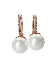 Photo of Elegant golden earrings with pearls on white background