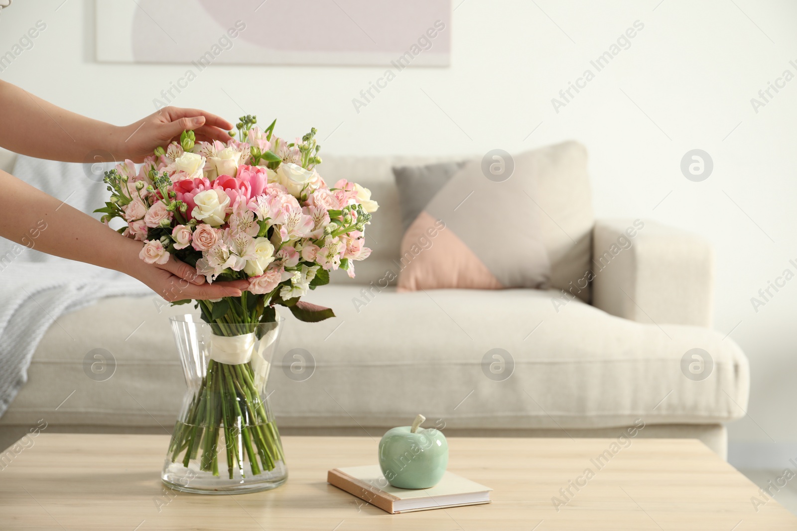 Photo of Woman with beautiful bouquet of fresh flowers at home, closeup. Space for text