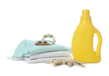 Photo of Detergent and children's clothes on white background