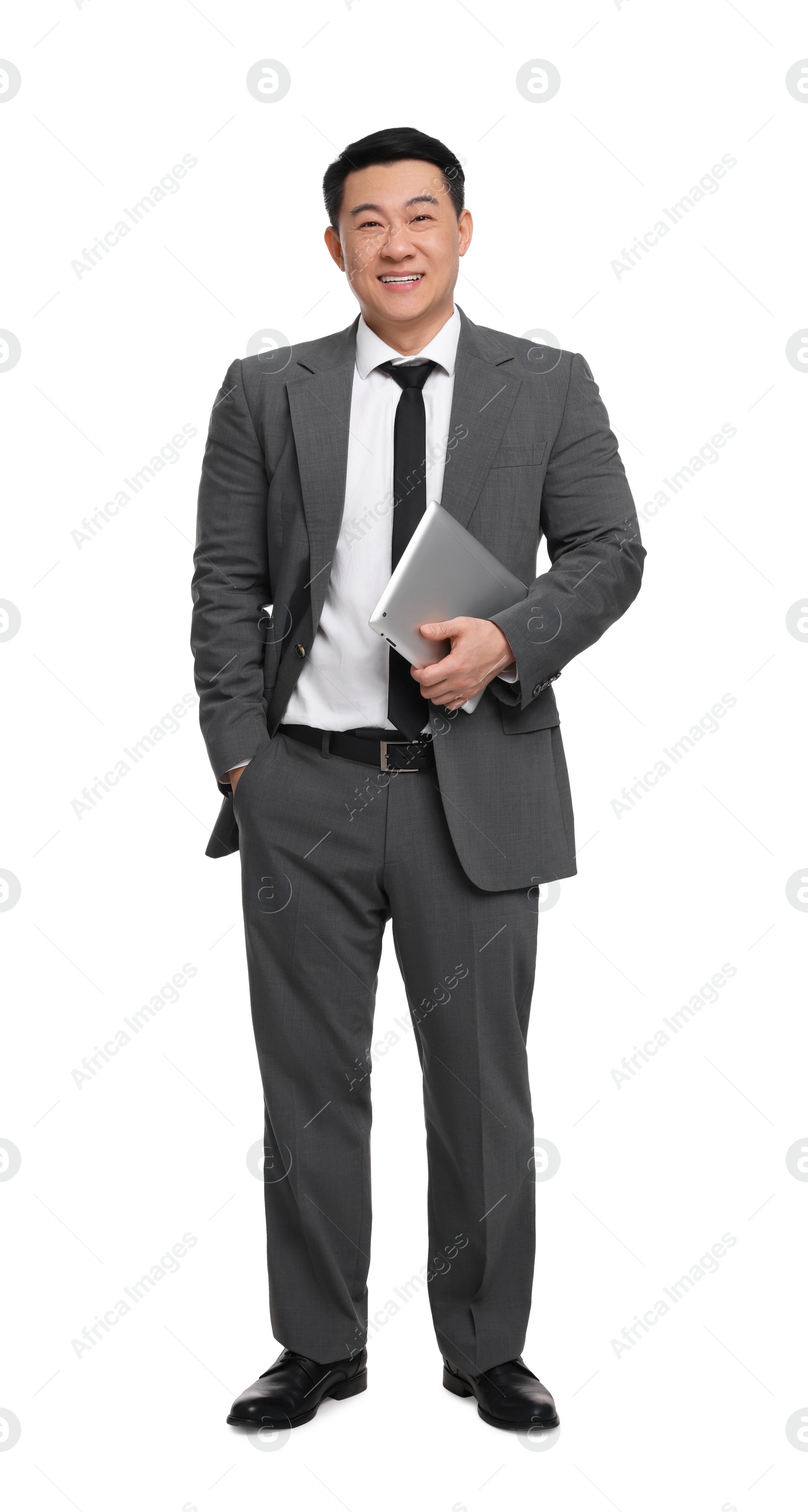 Photo of Businessman in suit with tablet on white background