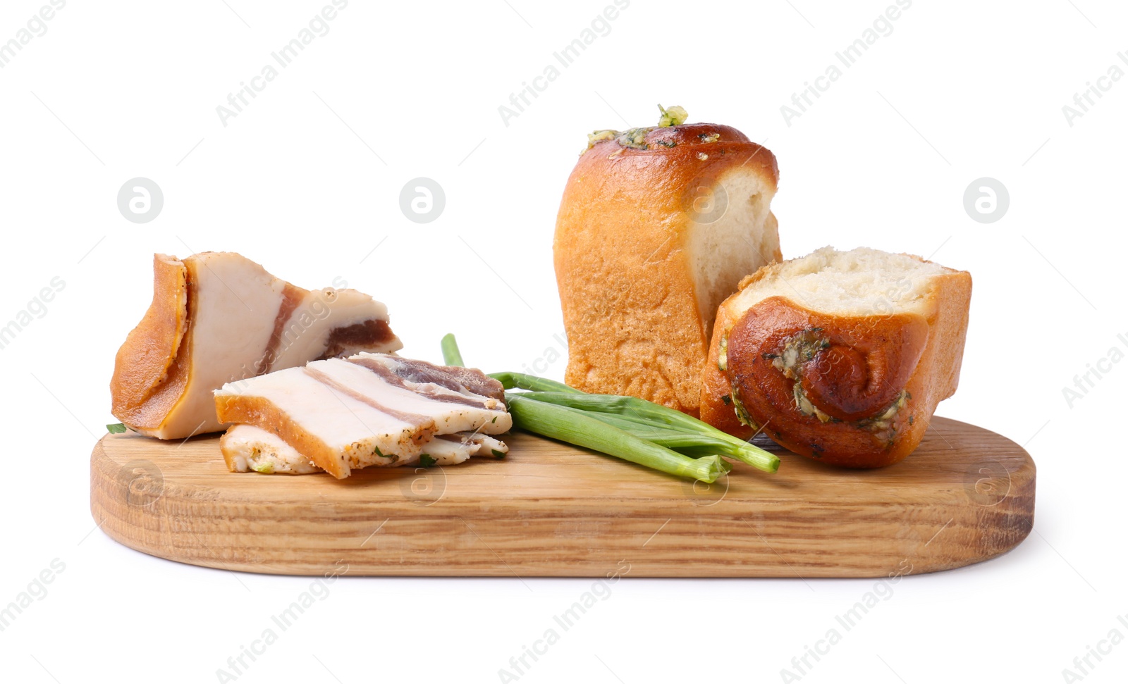 Photo of Board with delicious pampushky (buns), salo and green onions isolated on white