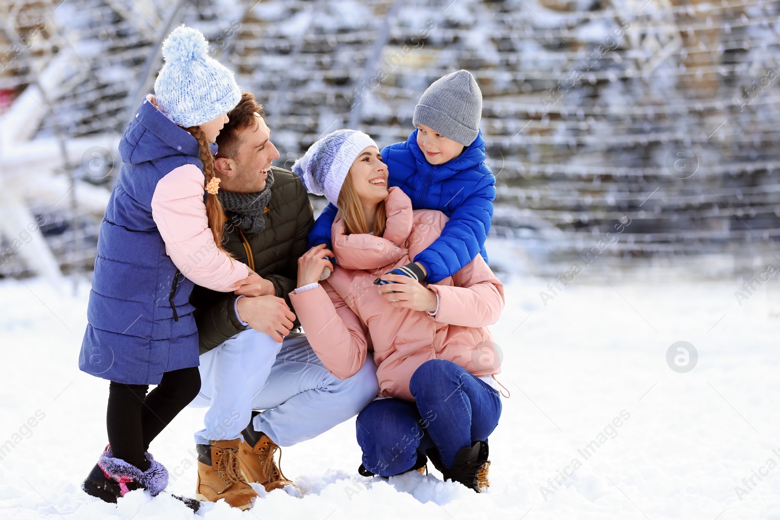 Photo of Portrait of happy family outdoors on winter day