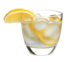 Soda water with lemon slices and ice cubes isolated on white