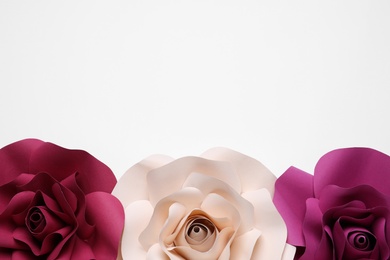 Different beautiful flowers made of paper on white background, top view