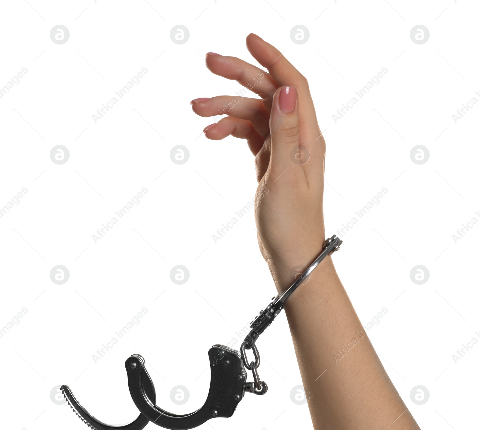 Photo of Freedom concept. Woman with handcuffs on her hand against white background, closeup