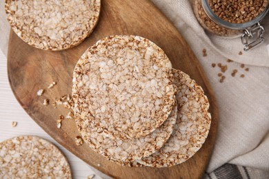 Photo of Stack of fresh crunchy rice cakes on white table, flat lay