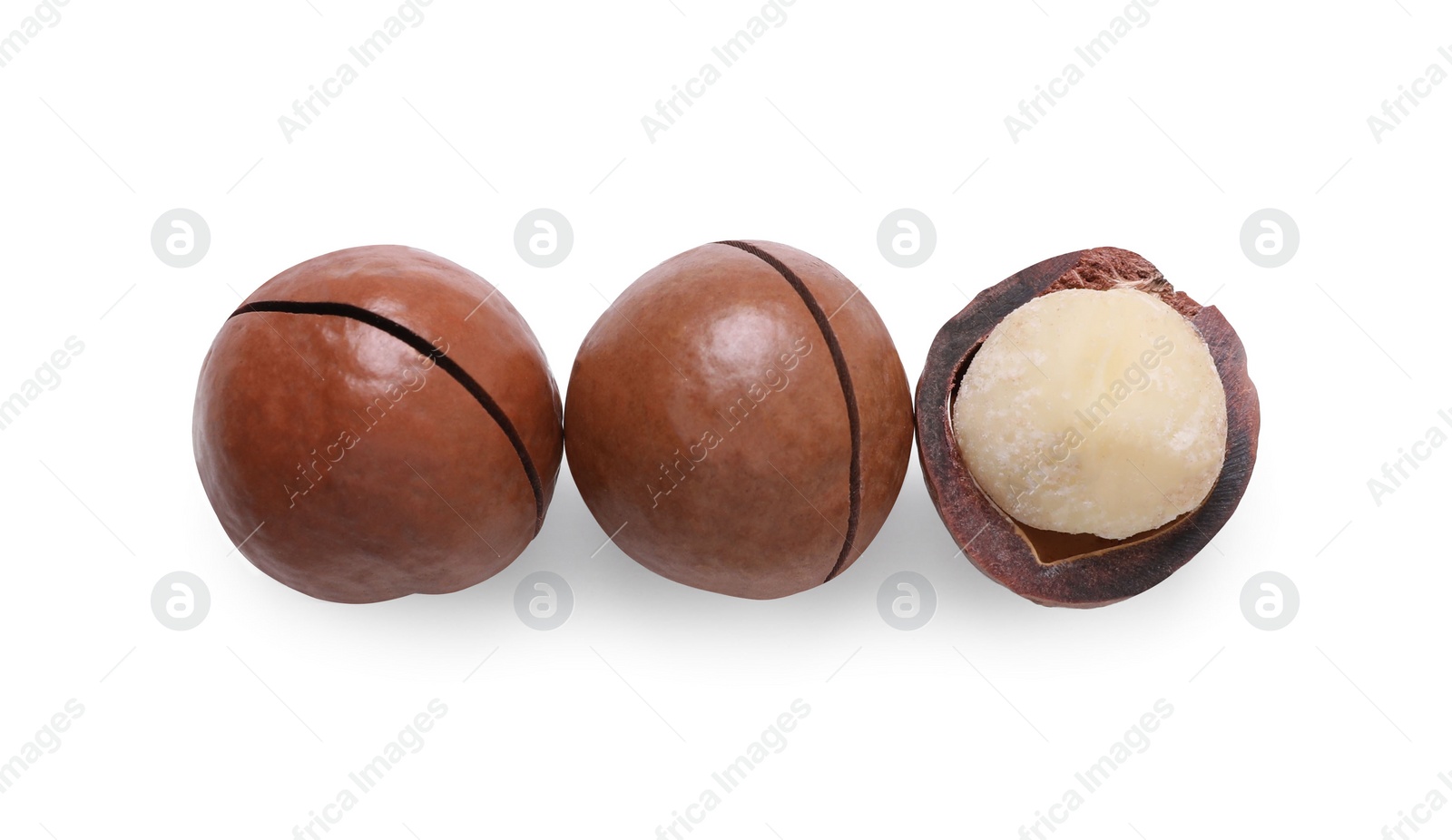 Photo of Delicious organic Macadamia nuts isolated on white, top view