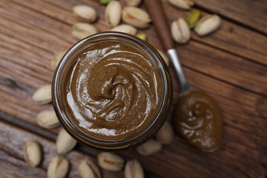 Photo of Tasty pistachio nut paste on table, top view