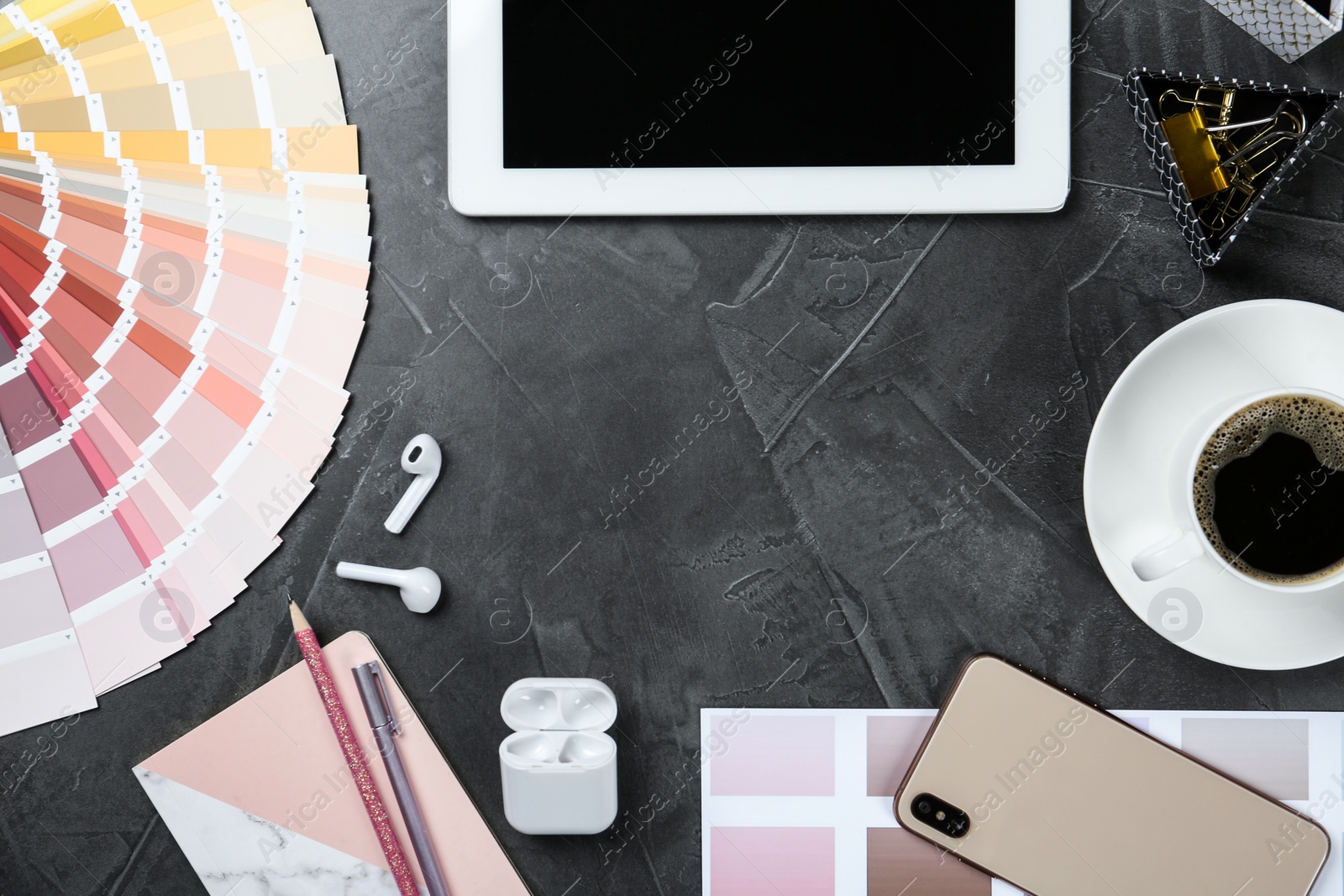 Photo of Flat lay composition with digital devices and color palette on grey background, space for text. Graphic designer's workplace