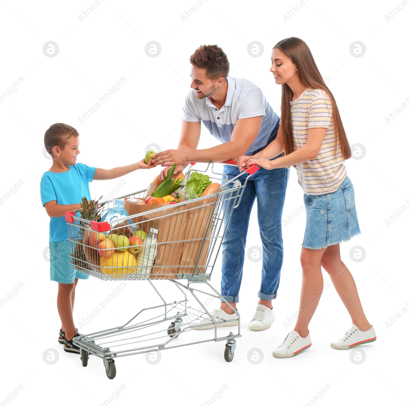 Photo of Happy family with full shopping cart on white background