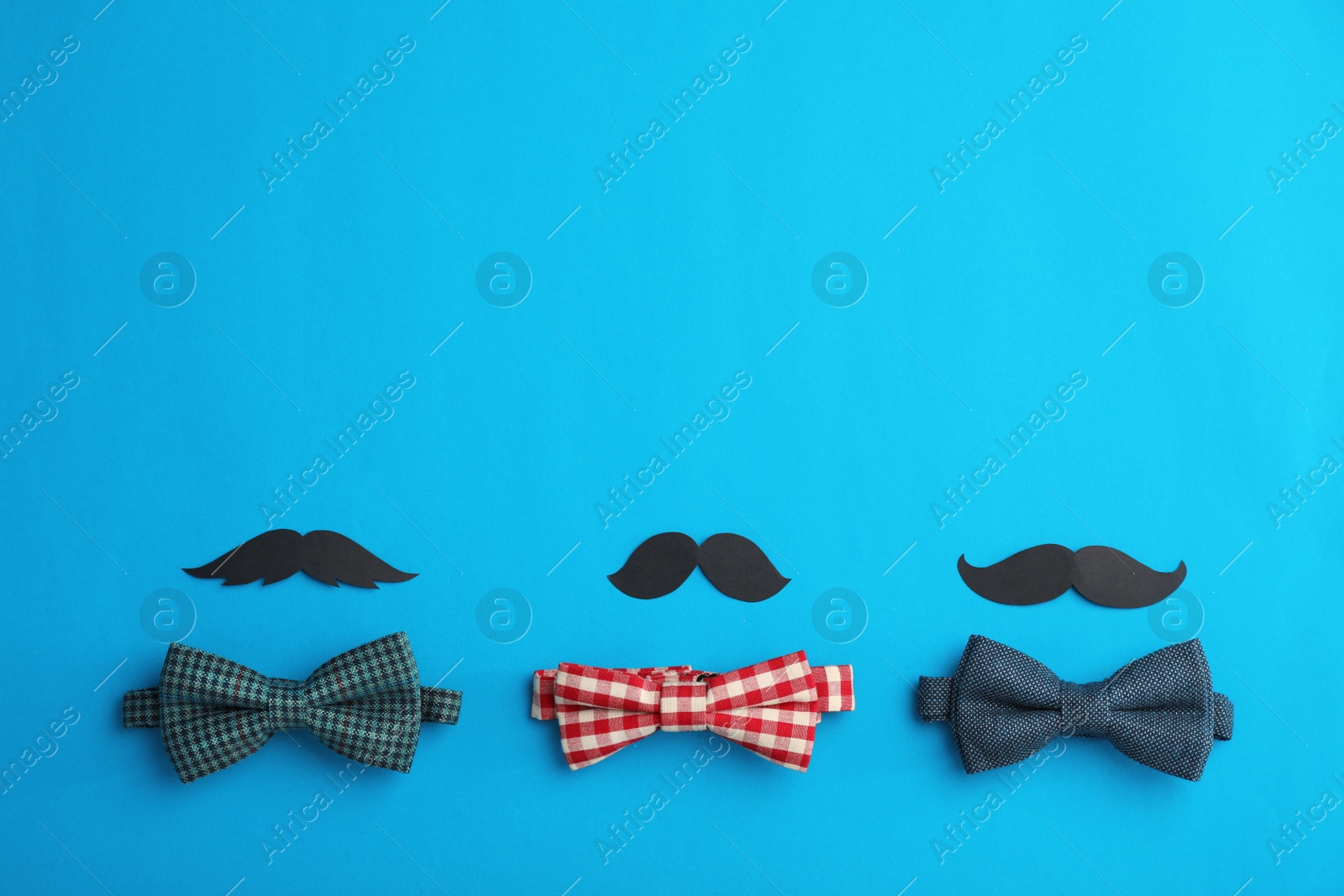 Photo of Flat lay composition with paper moustaches, bow ties and space for text on color background. Happy Father's Day