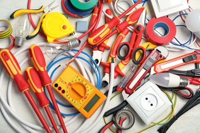 Photo of Set of electrician's tools on table, top view