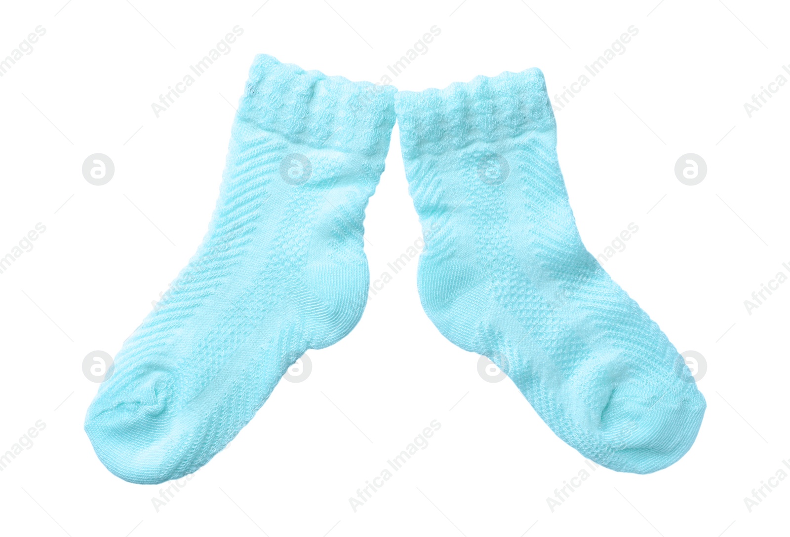 Photo of Cute child socks on white background, top view