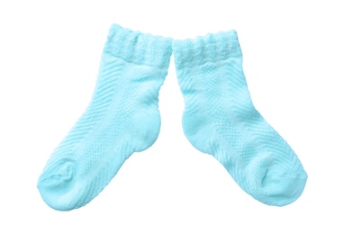 Photo of Cute child socks on white background, top view