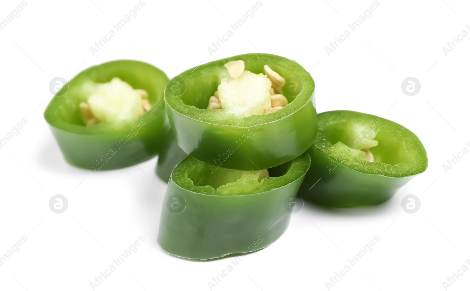 Photo of Cut green hot chili pepper on white background