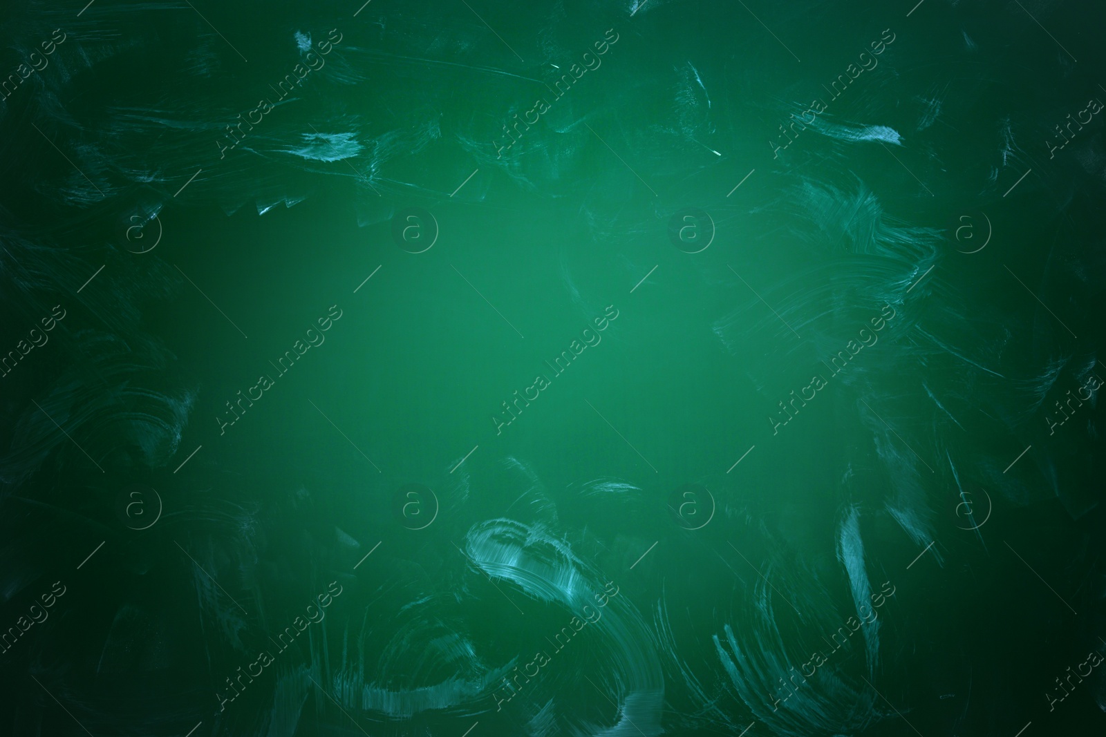 Image of Dirty green chalkboard as background. Vignette effect