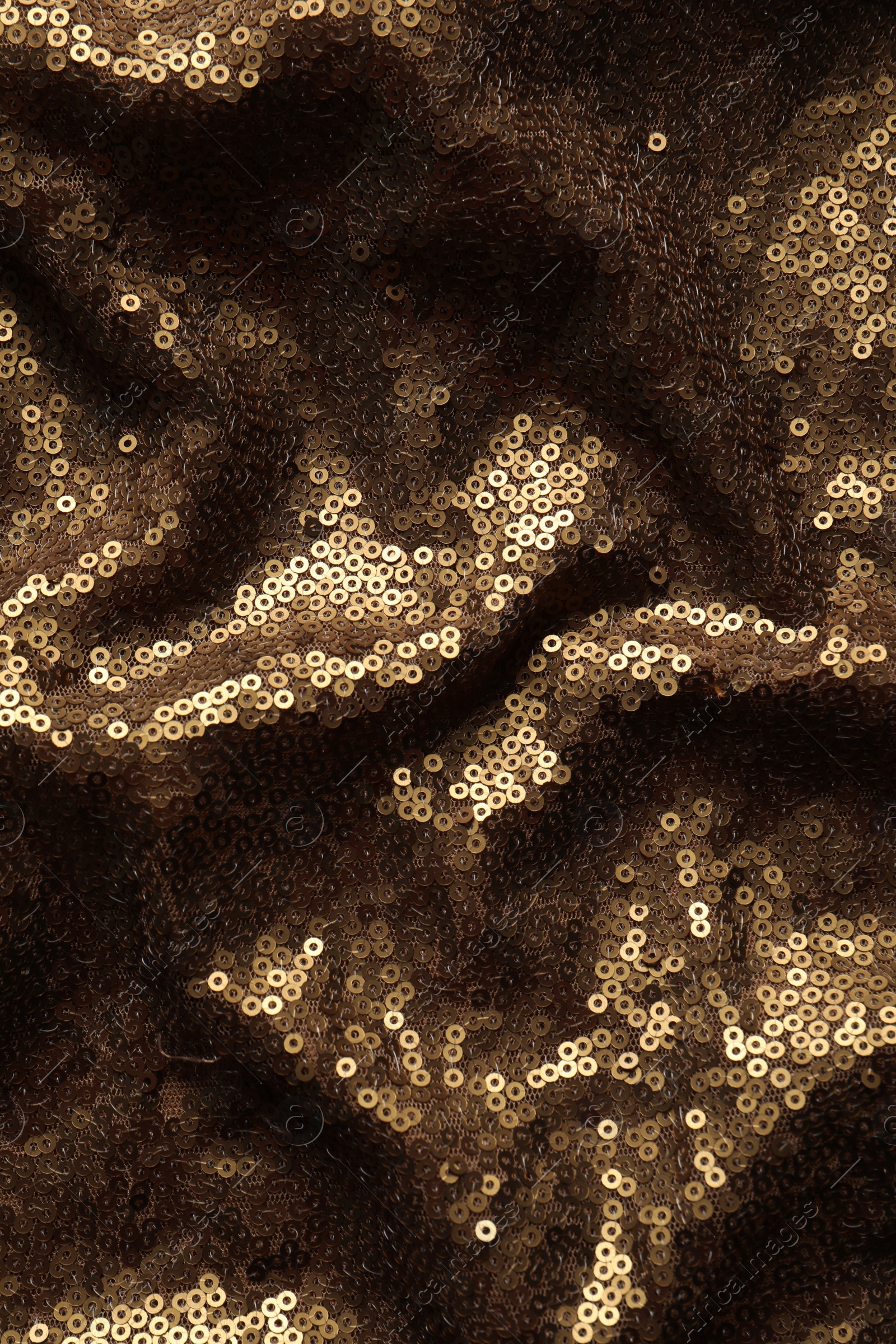 Photo of Beautiful golden sequin fabric as background, top view